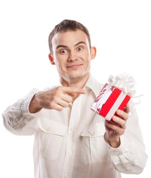 portrait of smiling man pointing on gift isolated on white background
