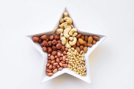 Mixed nuts in a dish in the form of stars