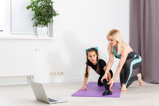 Time for yoga Attractive and healthy young woman doing exercises while resting at home