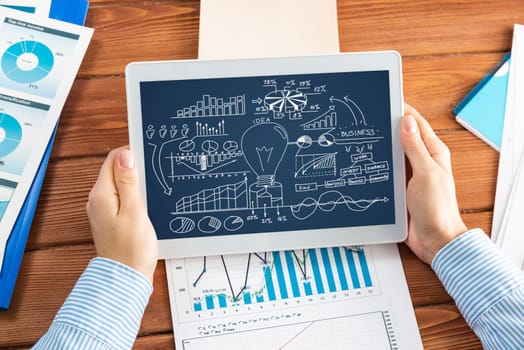 close-up, the business lady with the tablet. Concept of business planning