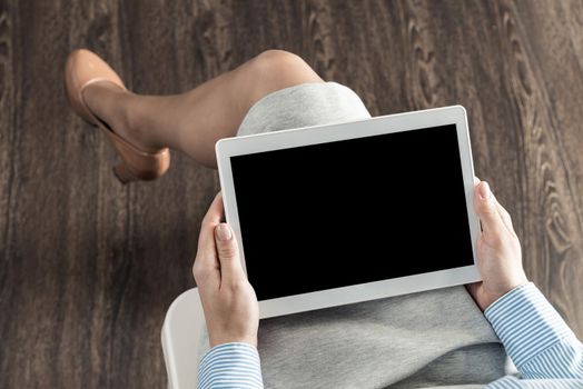 close-up of female hands with a computer tablet