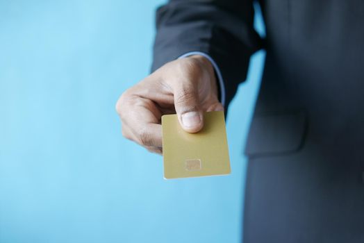 close up of person hand holding credit card.