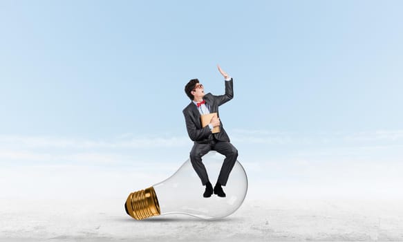 young businessman with a book. Concept of Creativity in Business