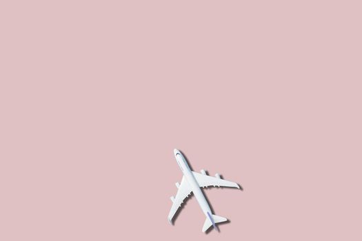 airplane figure on pink background