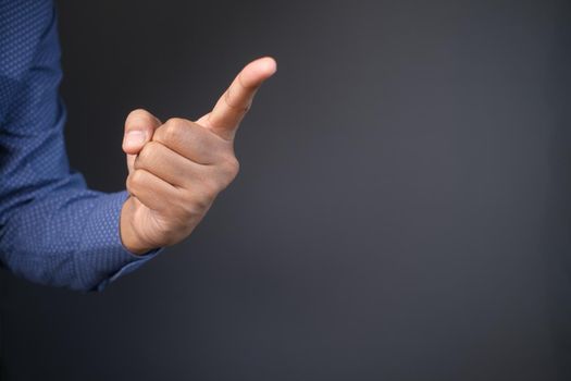 Businessman in suit point finger at camera