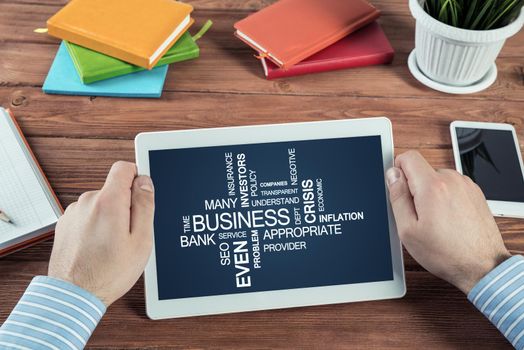 close-up, male hands with tablet. Businessman working at the table in office