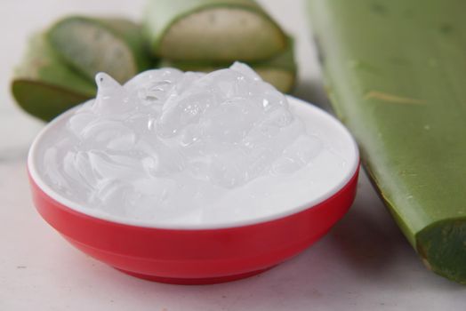 Close-up Fresh Aloe vera sliced and liquid gel on white background ,