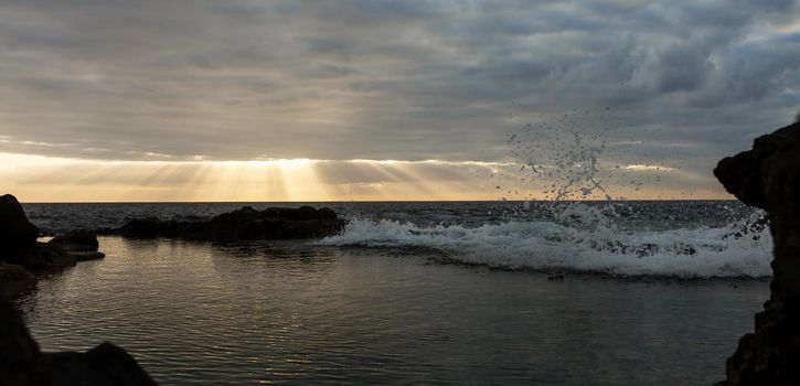 Old stone pier in sunset time at Tenerife, Canary Islands, Spain.