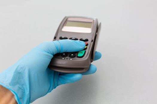 Payment on a trade through contactless card and NFC technology. Front view. Horizontal composition.