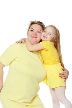 Young blonde mother, gently hugs her favorite little round-faced daughter. Family Idyll.Isolated on white background.