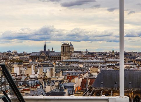 Paris / France - April 07 2019. View of Notre Dame Cathedral and cityscape from Center of Pompidou in the spring. Before the fire
