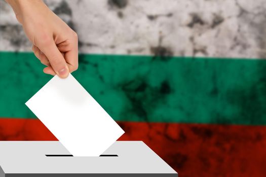 hand drops the ballot election against the background of the flag, concept of state elections, referendum