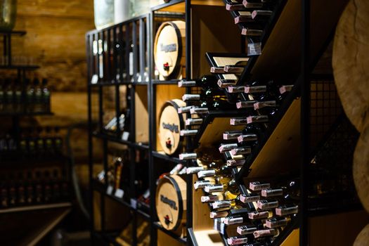 Interior of very old wine cellar with vintage wine pump and dried meat delicatessen