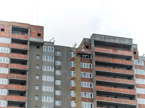 scaffolding on a building wall. building getting a new paint.