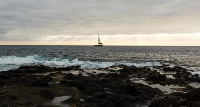 Calm ocean in the morning. ocean shore with stones.