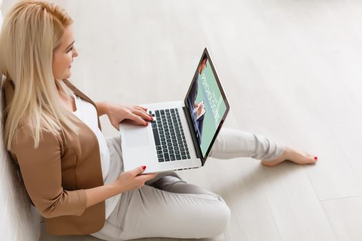Woman in front of her laptop having an online call with her therapist, text space