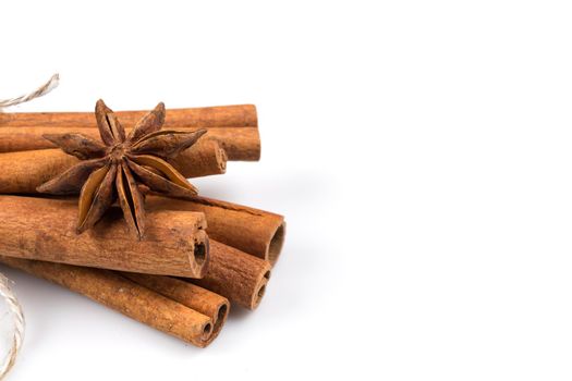 Stars of anise and cinnamon on white background