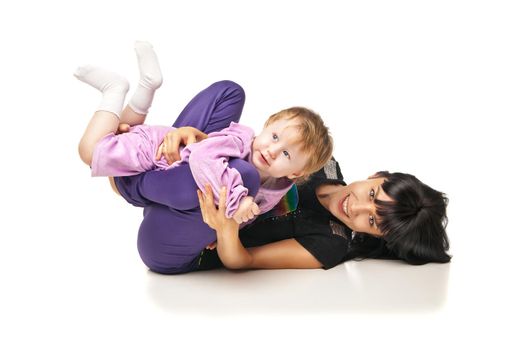 Yoga for woman and child. Mother with the baby doing exercises