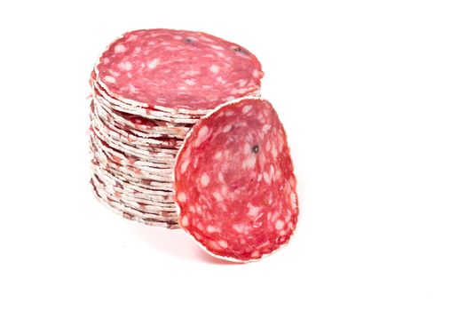 Slices of salami sausages isolated on a white background