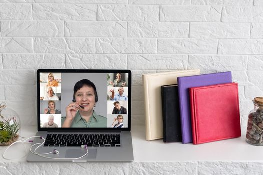 Many portraits faces of diverse young and aged people webcam view, while engaged in videoconference on-line meeting lead by businessman leader. Group video call application easy usage concept.