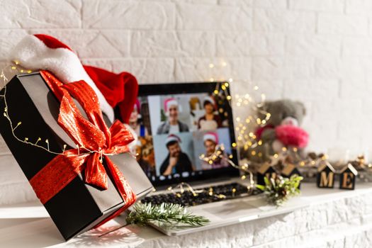 Christmas day Virtual meeting team teleworking. Family video call remote conference. Laptop webcam screen view. Diverse portrait headshots meet working from their home offices. Happy hour party online.