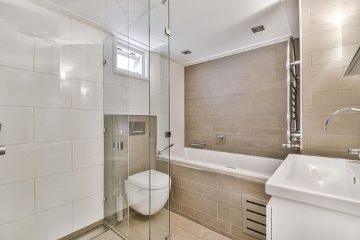 The interior of a modern bright bathroom with a stylish design