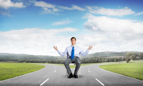businessman sitting on an office chair, meditation and calmness