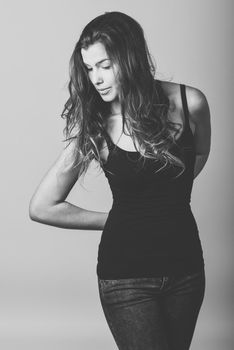 Portrait of beautiful young woman, model of fashion, wearing casual clothes. Studio shot