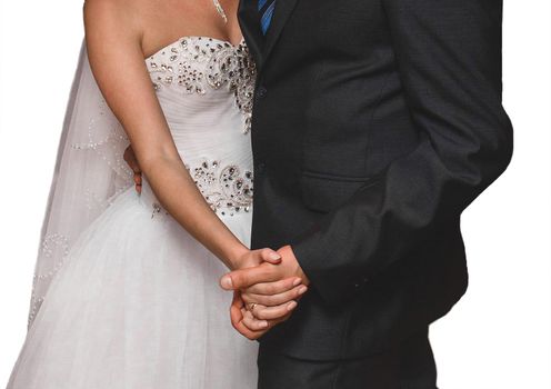 The bride and groom hold hands during a dance at the wedding on a white background, isolated.