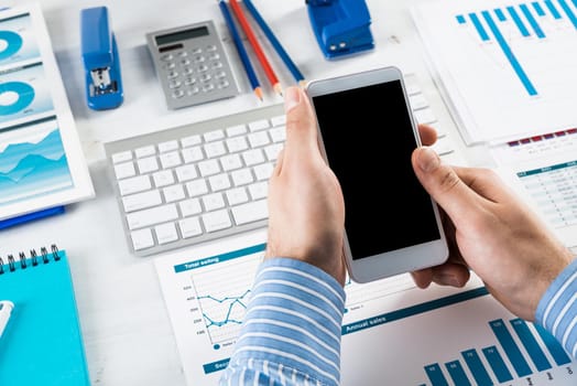 close-up of men's hands with a phone. Office work