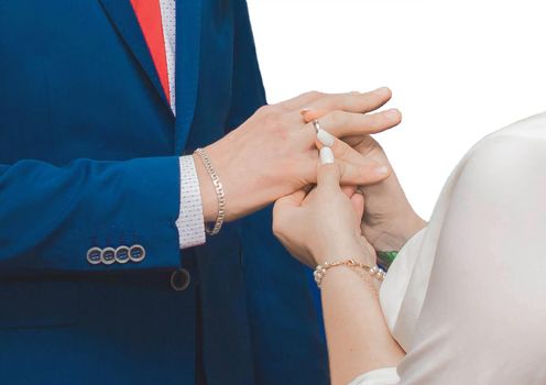 Sharing wedding rings at wedding close-up, on a white background, isolated.