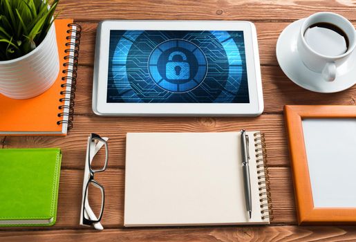 Business workplace with office stuff and tablet with padlock icons on screen
