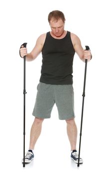 The concept of sports lifestyle and maintenance of health in adulthood. Fifty-year-old man, engaged in Nordic walking with special poles. Isolated on white background