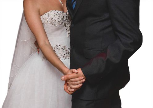 The bride and groom hold hands during a dance at the wedding on a white background, isolated.