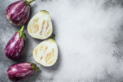 Raw purple Aubergine or eggplant. White background. Top view. Copy space.