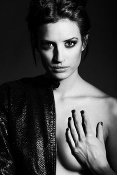 Portrait of woman with intense look on black background