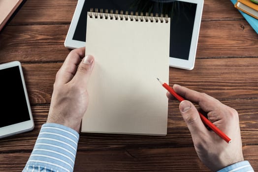 close-up of hands with notepad. office work