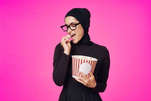 cheerful woman attractive look popcorn glasses movie watching purple background. High quality photo