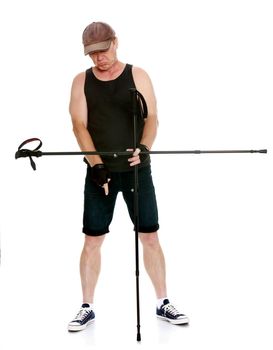 The concept of sports lifestyle and maintenance of health in adulthood. Fifty-year-old man, engaged in Nordic walking with special poles. Isolated on white background