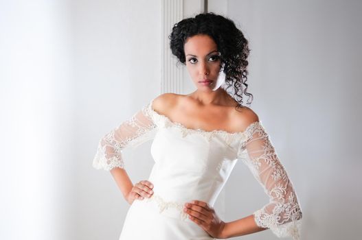 Portrait of a Young black woman, model of fashion, wearing a wedding dress