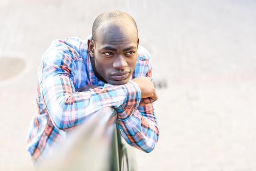 Portrait of black man wearing casual clothes in urban background