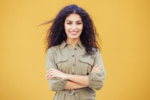 Young Arab Woman with curly hair in urban background
