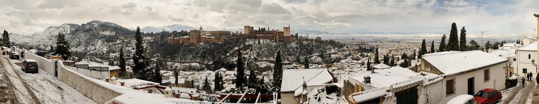 Panorama of snow Granada with Alhambra