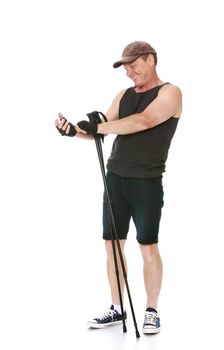 The concept of sports lifestyle and maintenance of health in adulthood. Fifty-year-old man, engaged in Nordic walking with special poles. Isolated on white background