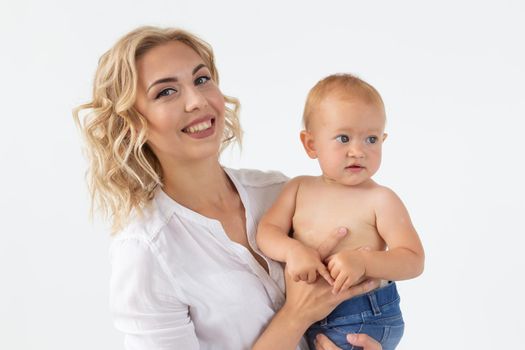 Childhood, motherhood and family concept - Portrait happy mother holds her baby.