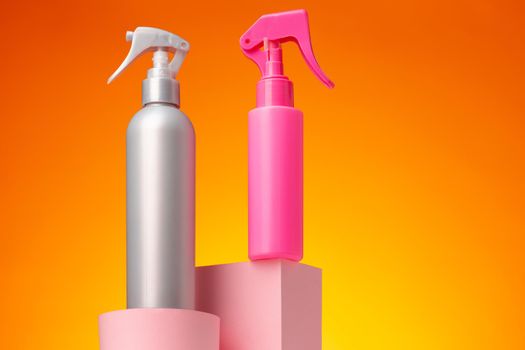 Skincare beauty products container against pink background, copy space