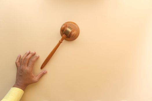 close up of person's hand striking the gavel