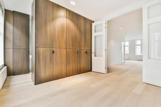 Bright room with a large brown wardrobe