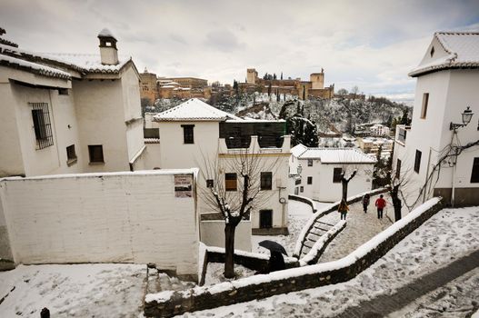 Snow storm with slush on sidewalks. Granada, Andalusia, Spain
