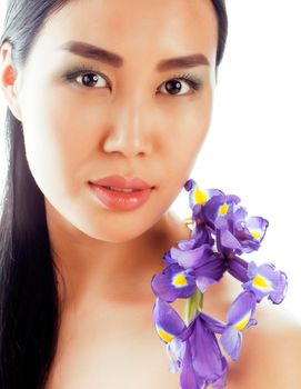 young pretty real asian woman with flower purple orchid close up isolated on white background spa, healthcare concept